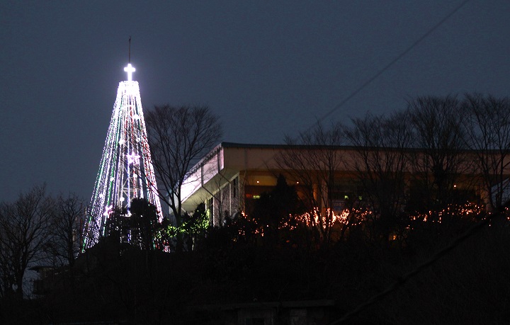 This Tuesday, Dec. 21, 2010 photo shows a giant steel Christmas tree lit up at the western mountain peak known as Aegibong in Gimpo, South Korea. A South Korean church group has canceled plans to erect the giant Christmas tree near the border with North Korea after locals complained that it could provoke Pyongyang. 