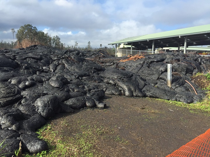 Lava from Hawaii's Kilauea volcano inches closer to the tiny town of Pahoa on December 18, 2014.In a series of photos, the smoldering mass of the Puna Lava Flow appeared stationary, for the time being, roughly 1,200 yards away from Pahoa Marketplace.