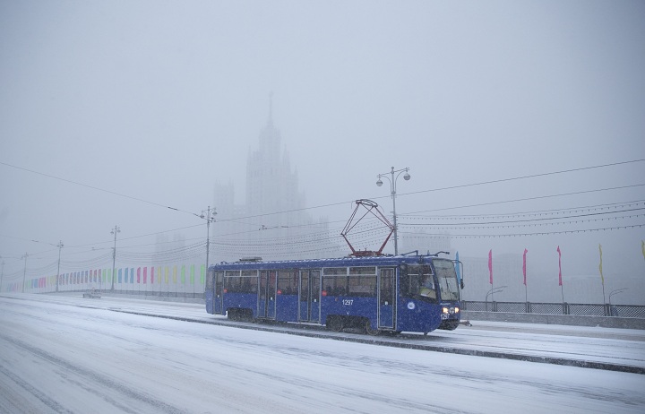 A tram rolls through a snowstorm in Moscow, Russia, Thursday, Dec. 25, 2014. 