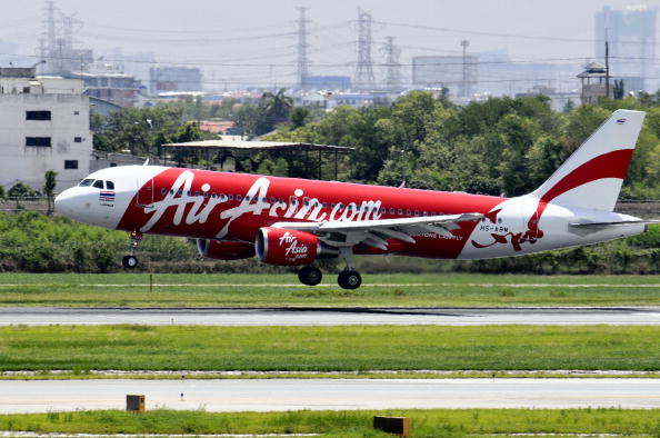 An AirAsia Bhd. airplane approaches landing at Suvarnabhumi Airport in Bangkok, Thailand, on Monday, May 31, 2010. 