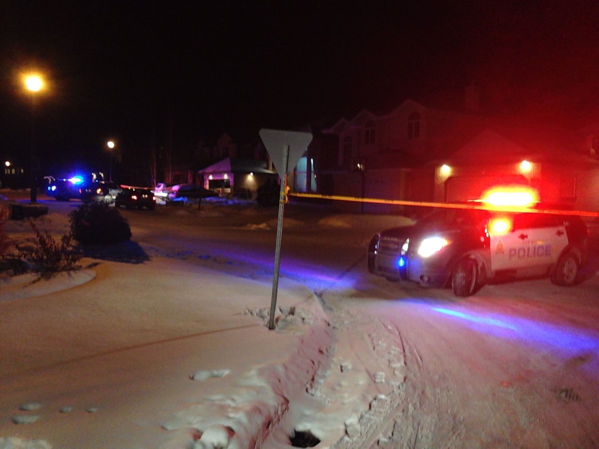 Police investigate a homicide near Haswell Court and 16 Avenue on Dec. 29, 2014.