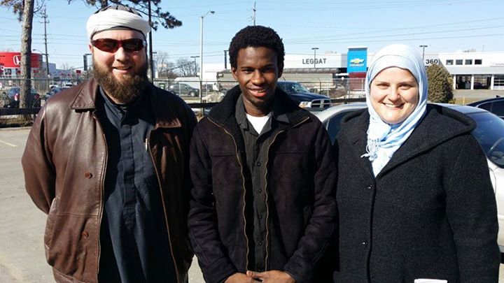 Muhammed Sillah, centre, is seen on the day of his release on March 21st, 2014. At right is his wife, Sarah Malette, and at left of Muhammad Robert Heft, a Toronto-based Muslim leader.
