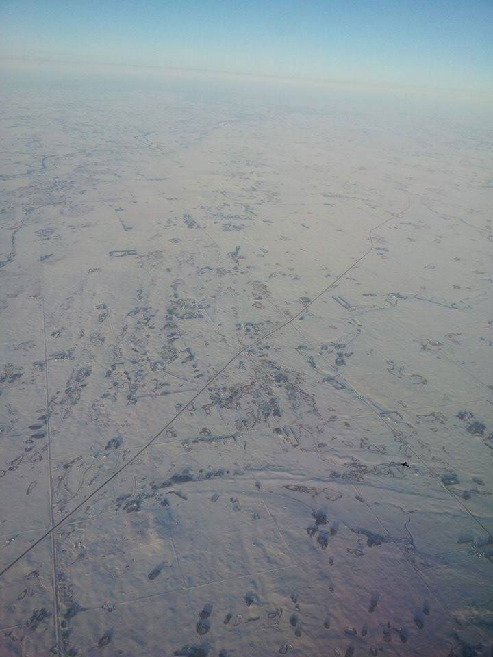 This photo was taken by Jeff Emard, approximately 25,000 feet above Saskatchewan.