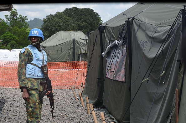 An UN soldier stands in front of a tent in the new Ebola Treatment Center US built by the United States army on November 10, 2014 in Tubmanburg, the provincial capital of Bomi County in western Liberia. 