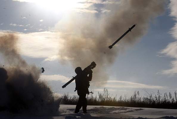 A Ukrainian soldiers fires a missile with a man-portable air-defense system during exercices near the city of Shchastya, north of Lugansk, on December 1, 2014.  At least three Ukrainian soldiers have been killed and 14 injured in the past 24 hours as fighting intensifies for control of Donetsk airport, a military spokesman said on December 1, 2014. 