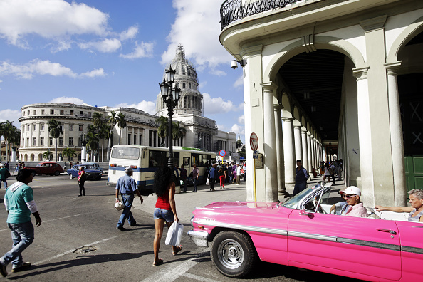 An American vintage car drives in Havana in December 2014. Cubans are eager for economic growth.