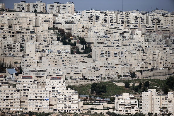 A partial view taken on December 18, 2014 shows the east Jerusalem Israeli settlement of Har Homa from the West Bank city of Bethlehem, which was originally built in the 1990s, in the annexed Arab east Jerusalem area of Jabal Abu Ghneim.