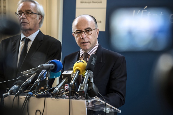 French Interoir Minister Bernard Cazeneuve gives a press conference in the Dijon prefecture, eastern France, on December 22, 2014 a day after people were injured in the car attack. A driver shouting "Allahu Akbar" ("God is greatest") ploughed into pedestrians on December 21, injuring 11 of them, just a day after a man yelling the same words was killed in an attack on police officers. Two of the people injured were in a serious condition, a police source said, adding that the driver had been arrested.
