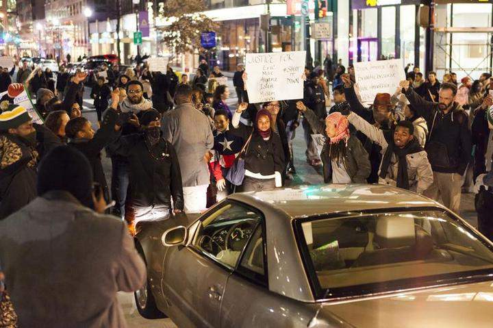 Protestors block the road during a protest after two grand juries decided not to indict the police officers involved in the deaths of Michael Brown in Ferguson, Mo. and Eric Garner in New York, N.Y. in Washington, D.C. on December 3, 2014.