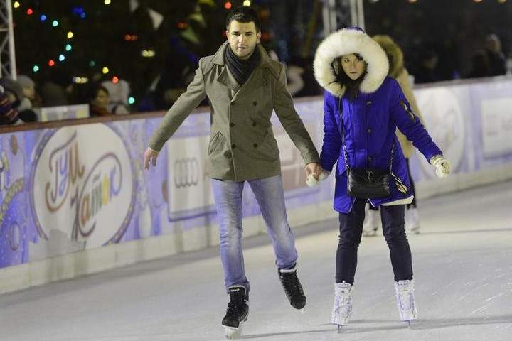 People skate along a skating ring set up at a shopping mall in Moscow, Russia on December 1, 2014.