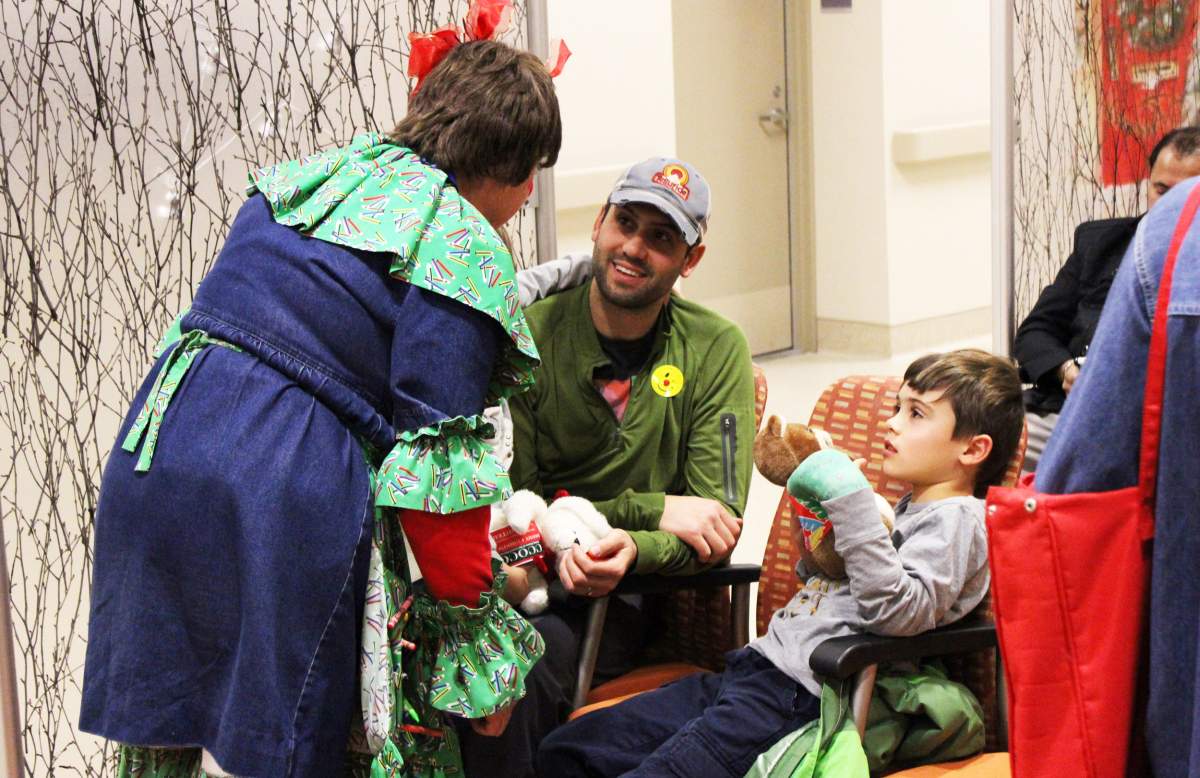 Trish Mather as “Peppermint Pate” with the Caring Clowns handing out presents to families and children throughout Kelowna General Hospital.