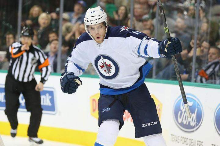 Adam Lowry of the Winnipeg Jets celebrates his first of two goals against the Stars in Dallas on Tuesday.