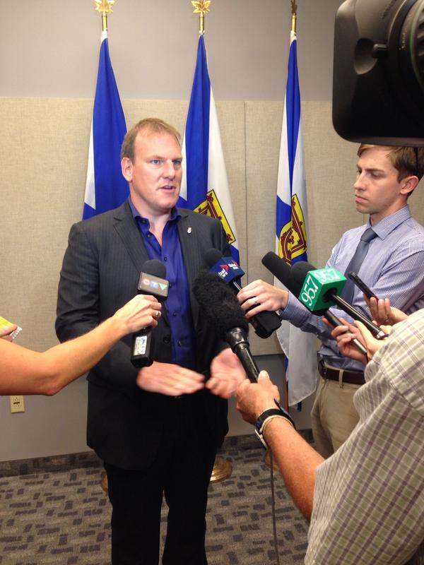 Former Energy Minister Andrew Younger speaks to reporters on Sept. 4, 2014.