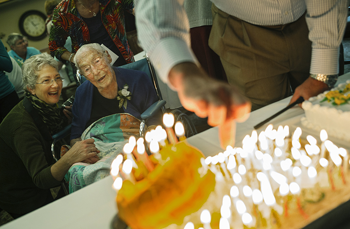 This Oct. 12, 2014 photo shows Anna Stoehr, centre, celebrating her 114th birthday at Green Prairie Place senior apartments in Plainview, Minn. 