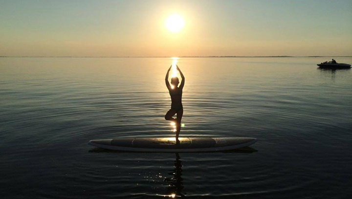 Aug 11: This photo was taken by Jill Carberry of her daughter doing yoga on a paddle board at Jackfish Lake.