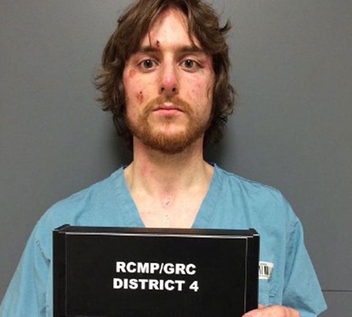 Justin Bourque is shown in this RCMP booking photo taken June 6, 2014. A judge in New Brunswick ordered the release Friday of all exhibits entered into evidence at the sentencing hearing of Justin Bourque in the killing of three Mounties in Moncton.
