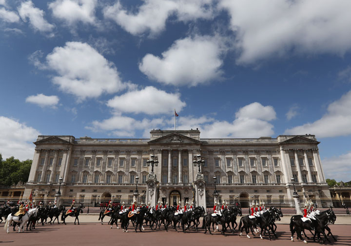 This is a Saturday, June 8, 2013  file photo members of Household Cavalry as they ride outside Buckingham Palace in central London. 