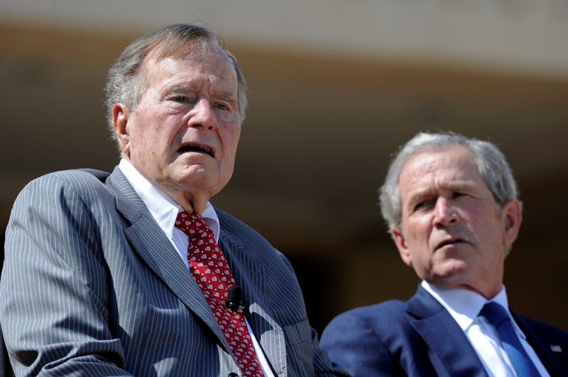 Former US Presidents George H.W. Bush and George W. Bush attend the George W. Bush Presidential Center dedication ceremony in Dallas, Texas, on April 25, 2013. 