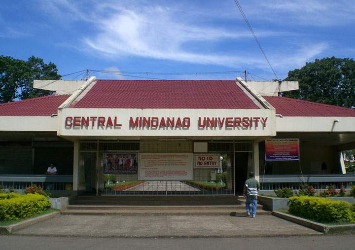 A suspected bomb explosion killed at least nine people and wounded more than 20 others Tuesday in a bus in front of a university in the southern Philippines, police said.