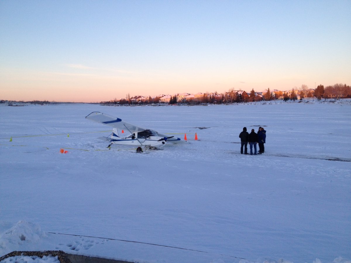 The Transportation Safety Board is investigating after a small plane breaks through the ice at Chestermere Lake.