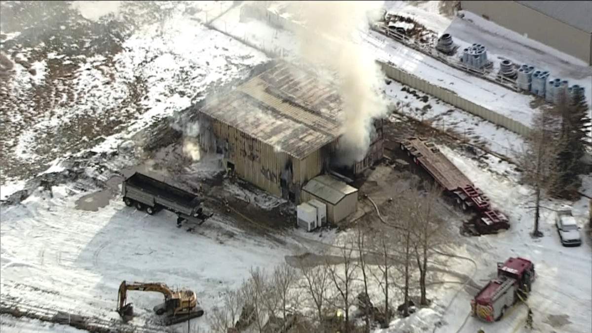 Firefighters say the rural building was engulfed in flames when they arrived, generating heavy smoke. 