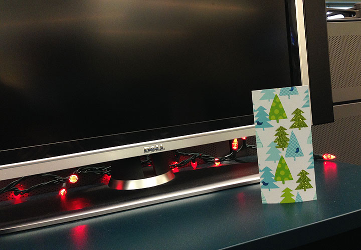 A single lonely Christmas card sits on a table.