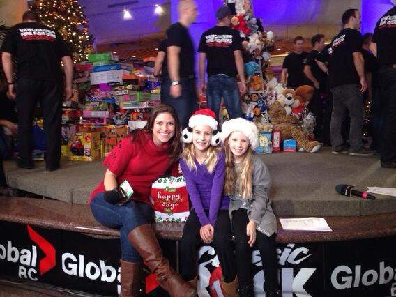 Kaitlyn Herbst and two special guests at the Christmas Wish Breakfast.