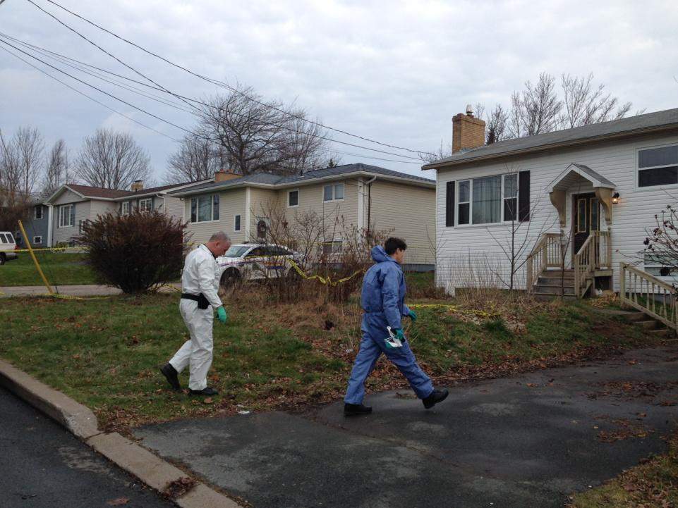 Forensic investigators make their way onto the scene of a shooting on Arklow Drive in Cole Harbour on Dec. 1, 2014.