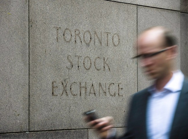 A man walks past a building in Toronto that used to house the Toronto Stock Exchange on August 18 2011.