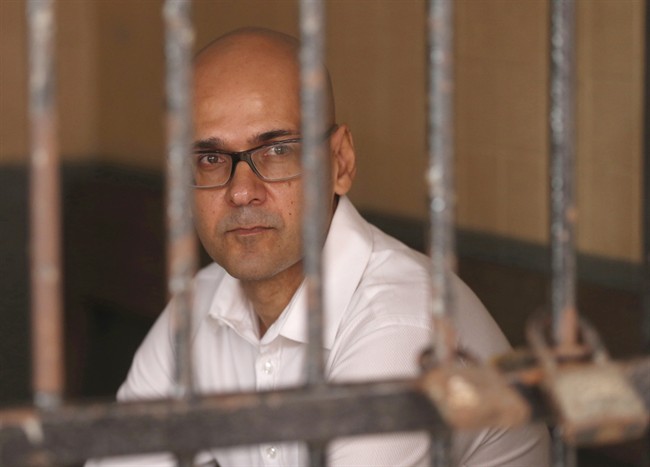 Canadian teacher Neil Bantleman, of Burlington, Ont., sits in a holding cell prior to the start of his trial hearing at South Jakarta District Court in Jakarta, Indonesia, Tuesday, Dec. 2, 2014.