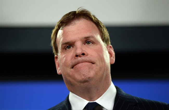 Minister of Foreign affairs John Baird holds a press conference at the National Press Theatre in Ottawa on Dec. 19, 2014. 