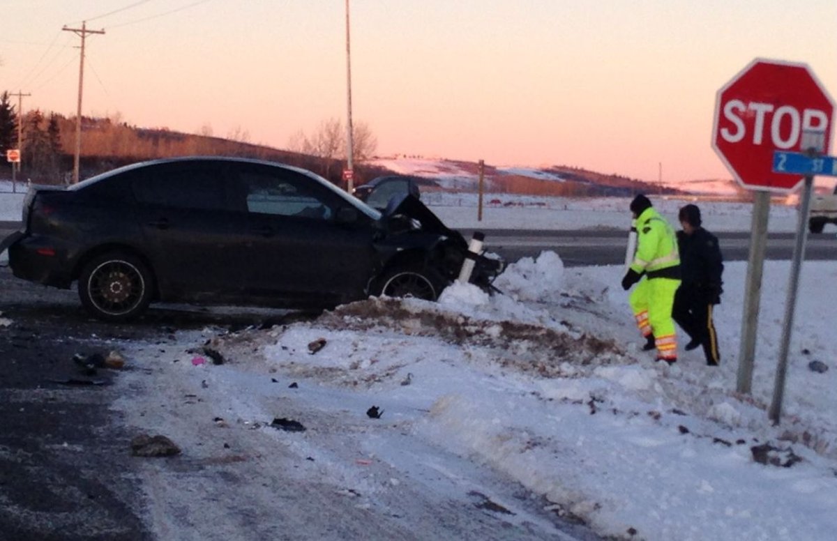 Emergency crews respond to a fatal two car crash on Highway 2A and Dunbow Road on Wednesday, December 03, 2014.
