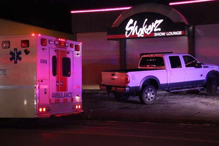 Two men in hospital after double stabbing near Surrey strip club - image