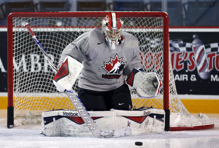 Eric Comrie faces shots during the Canada National Junior Team practice at the Meridian Centre on December 15, 2014 in St Catharines, Ontario.  