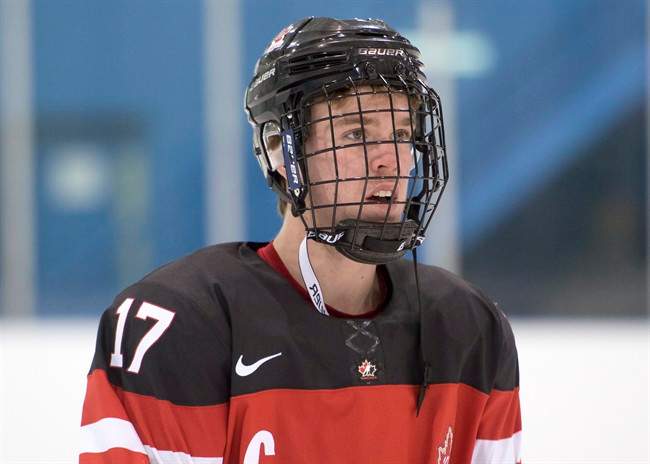 Team Canada's Connor McDavid is shown while waiting for team photos in Toronto on Saturday, December 20, 2014.