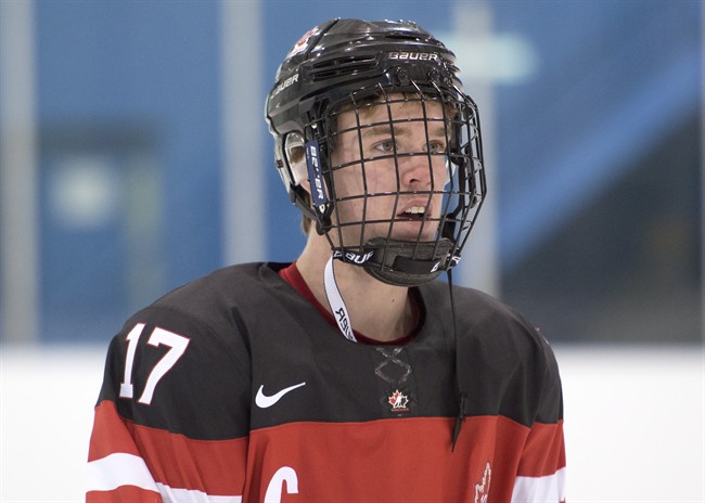 Team Canada's Connor McDavid is shown while waiting for team photos in Toronto on Saturday, December 20, 2014.