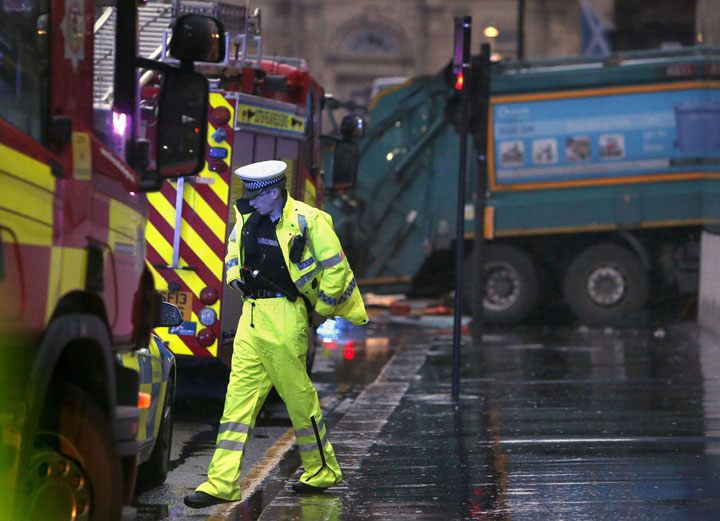 The scene in George Square in Glasgow Scotland  after a garbage truck crashed into a group of pedestrians Monday Dec. 22, 2014. 