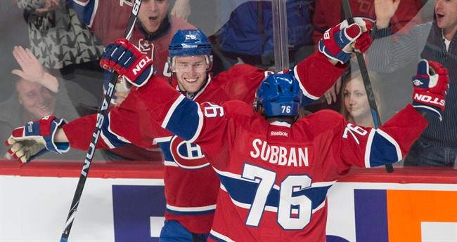 Montreal Canadiens' Jiri Sekac, left, celebrates with teammate P.K. Subban after scoring against the Los Angeles Kings during third period NHL hockey action in Montreal.
