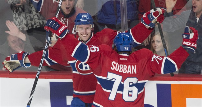 Montreal Canadiens' Jiri Sekac, left, celebrates with teammate P.K. Subban after scoring against the Los Angeles Kings during third period NHL hockey action in Montreal.