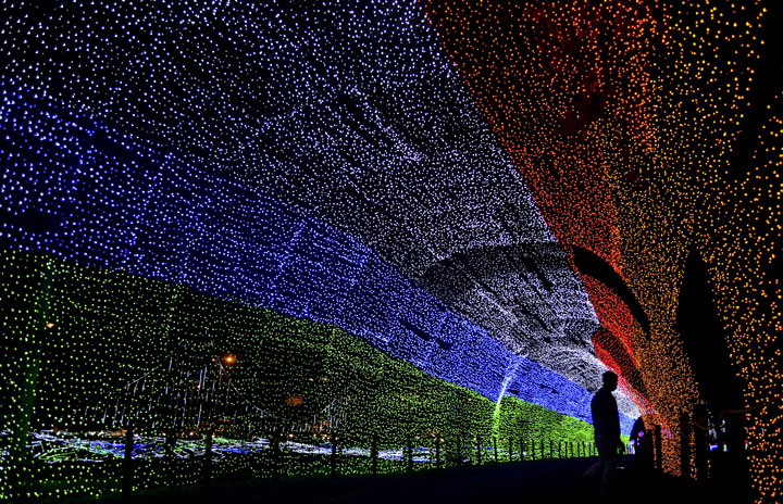 Christmas lights illuminate the Medellin River on December 9, 2014 in Medellin, Antioquia department,