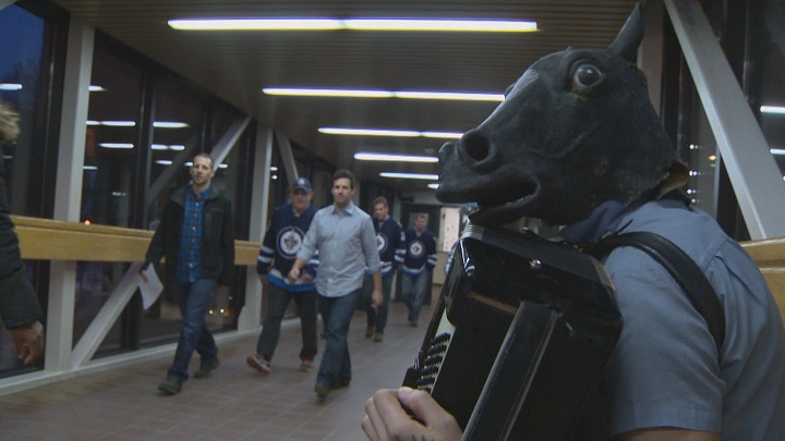 Blaine Mattes performs in the skywalk before a Winnipeg Jets game.