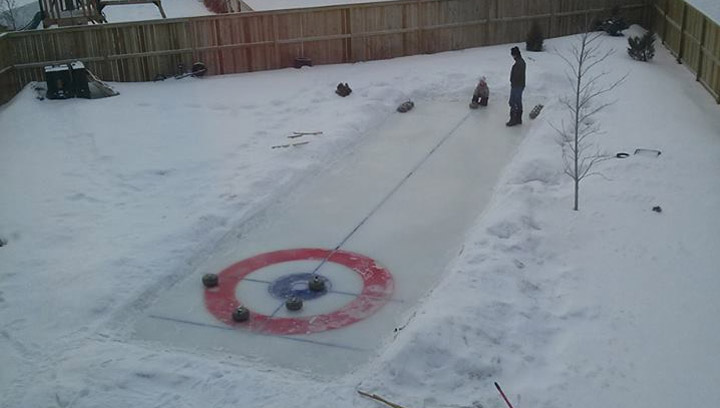 Jan 30: This picture was taken by Natal Laycock of a backyard rink in Saskatoon, with rocks from the Black Bonspiel at Persephone.
