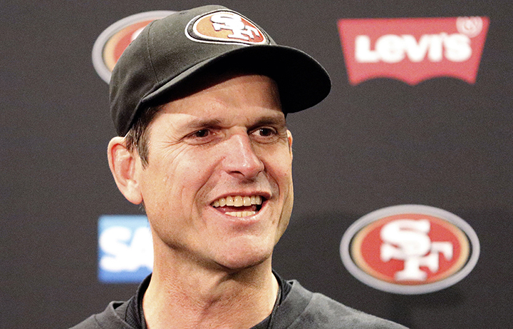 San Francisco 49ers head coach Jim Harbaugh speaks at a news conference after the 49ers defeated the Arizona Cardinals 20-17 in an NFL football game in Santa Clara, Calif., Sunday, Dec. 28, 2014. 