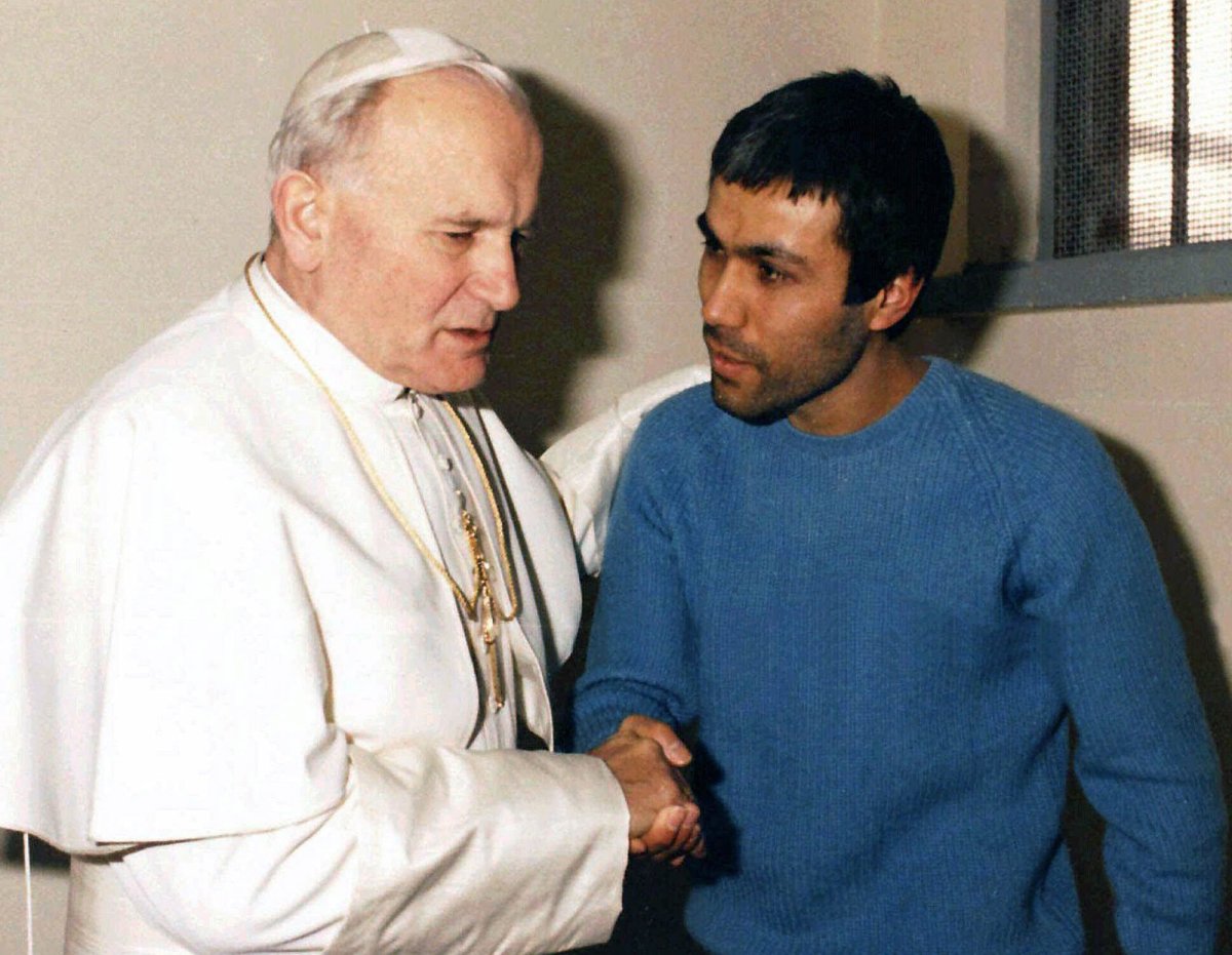 Pope John Paul II, left, meets Mehmet Ali Agca, in Agca's prison cell in Rome in 1983. 
