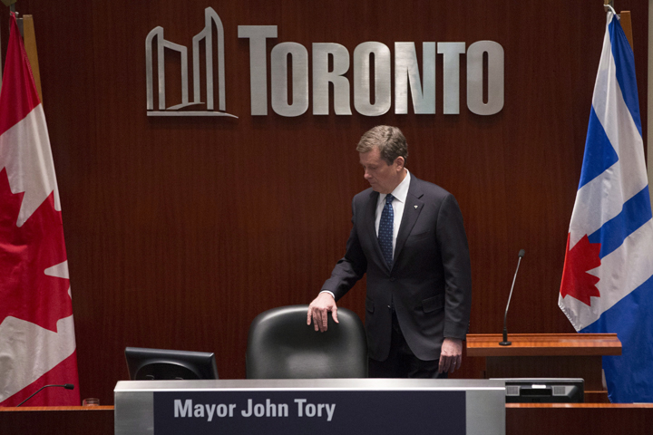 Toronto's newly elected Mayor John Tory takes his seat in council during an inauguration ceremony in Toronto on Tuesday, December 2, 2014.