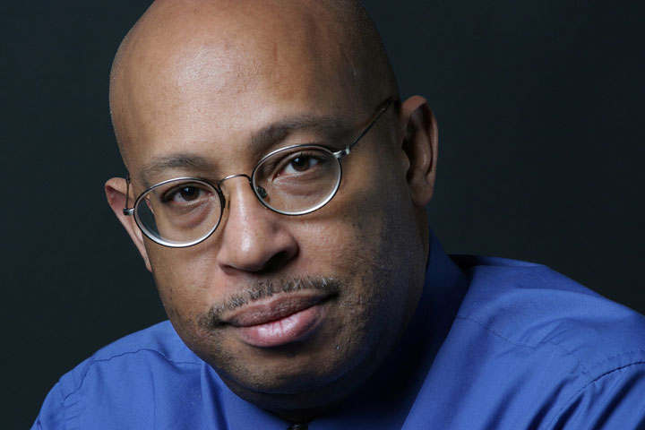 This April 15, 2004 photo shows Michel du Cille, a photographer and former photo editor with The Washington Post. Three time Pulitzer Prize winner, du Cille died Thursday Dec. 11, 2014 while on assignment  chronicling Ebola patients and their caretakers for the Post in Liberia. He was 58. 