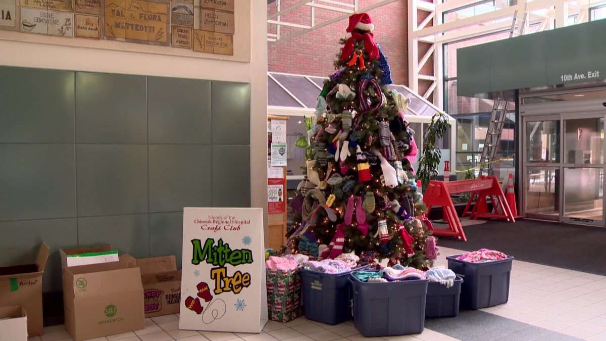 Mittens, hats and scarves hang from 'mitten tree' at Chinook Regional Hospital in Lethbridge.