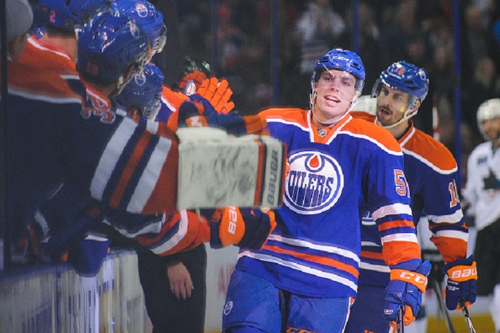 David Perron #57 of the Edmonton Oilers celebrates after scoring the game-winning goal against the San Jose Sharks during an NHL game at Rexall Place on December 7, 2014 in Edmonton, Alberta, Canada. The Oilers defeated the Sharks 2-1.