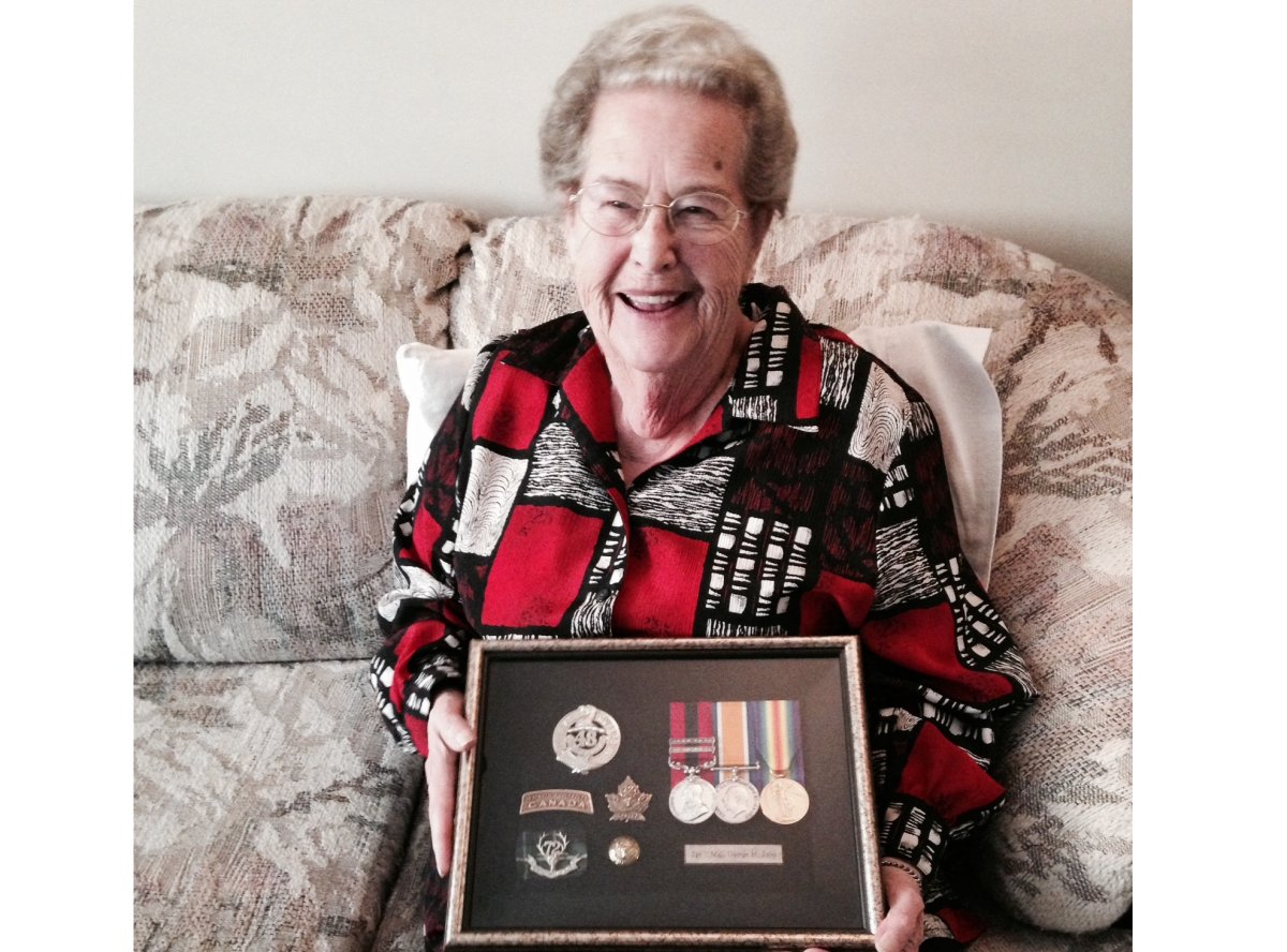 Grace Madill with her father's WW1 medals. 