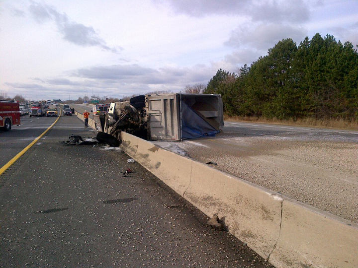 The OPP tweeted this photo of the turned-over truck following the crash in Bowmanville